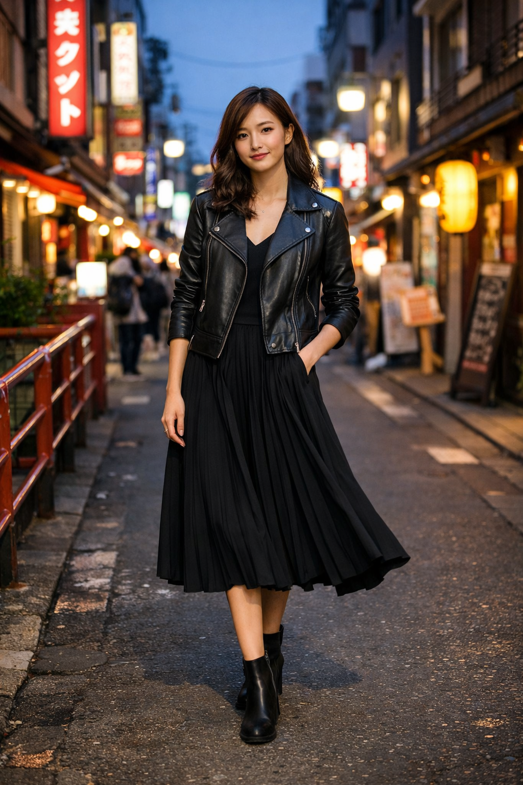 Black leather moto jacket layered over pleated midi dress for edgy tokyo outfits style